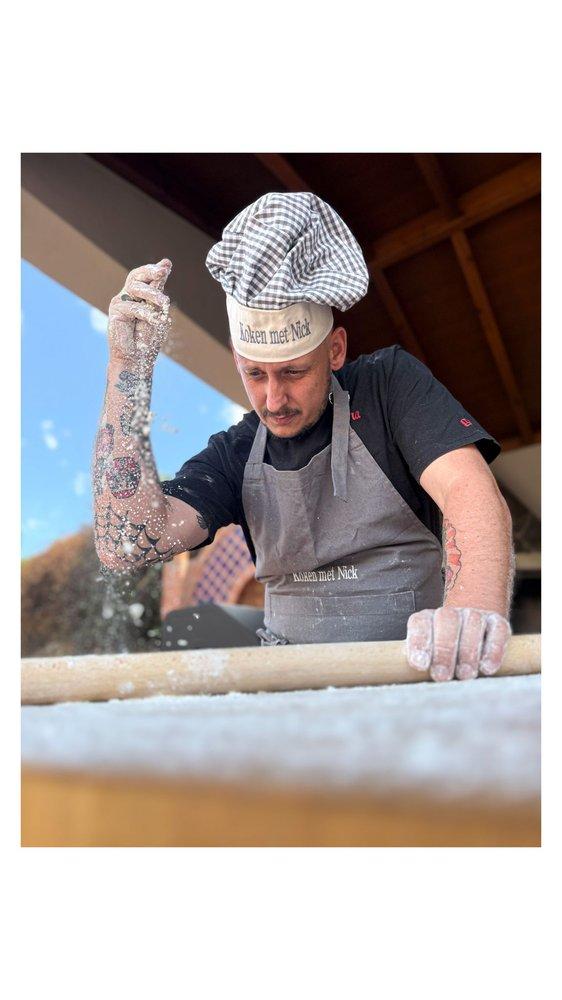 Nick cooking for guests