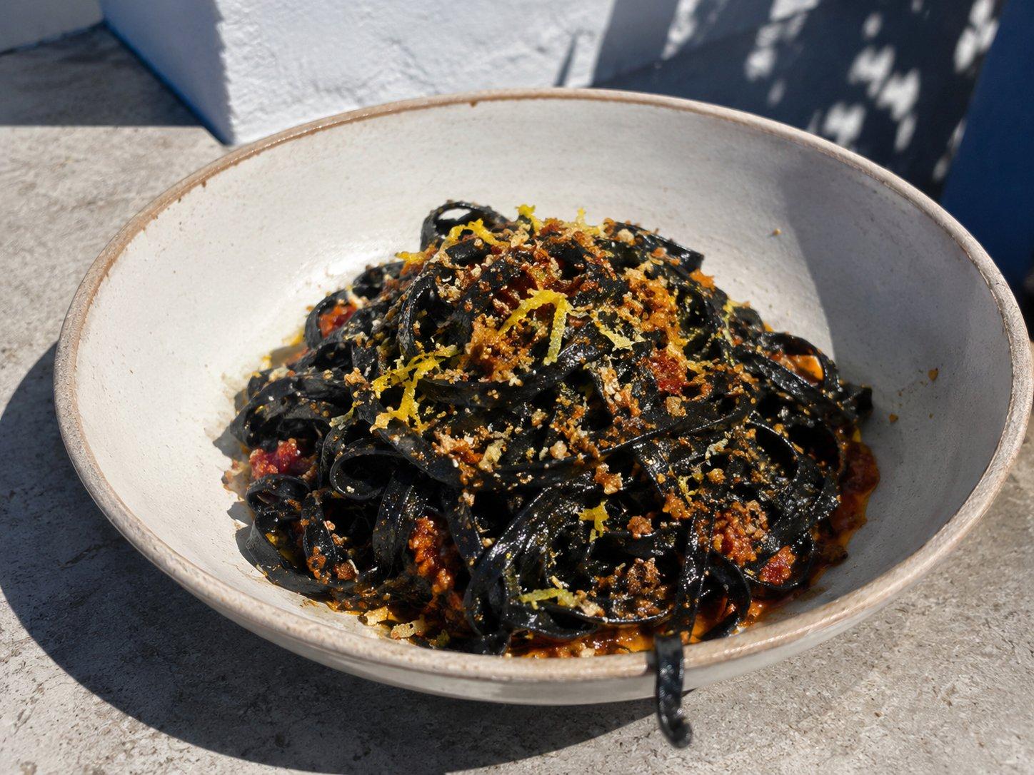 Squid-ink tagliatelle with calamari, 'nduja and lemon
